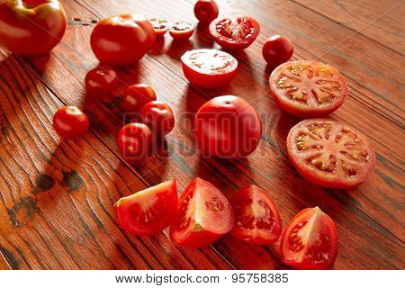 Tomatoes in a red monochrome rustic wooden table
