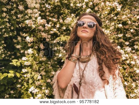 Relaxed Bohemian Young Woman Among Flowers