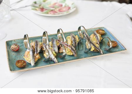 Anchovies With Guacamole And Tomato