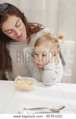 Baby Eating From Tupperware With Mother