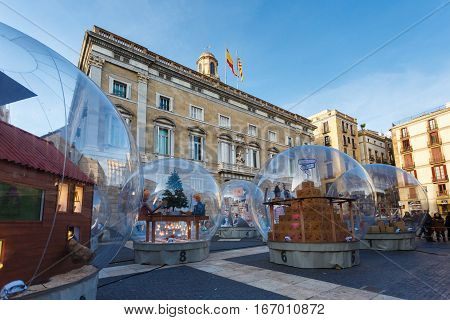 Barcelona Spain - January 02 2017: Large glass ball at the Plaza de San Jaume near the Palace of Generalitat of Catalunya