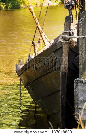 An Old Viking Ship In The Water At The Dock