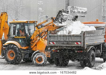 Snow plow outdoors cleaning street
