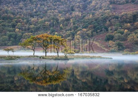 Beautiful Autumn Fall Landscape Image Of Crummock Water At Sunrise In Lake District England