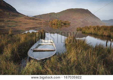 Beautiful Autumn Fall Landscape Image Of Crummock Water At Sunrise In Lake District England