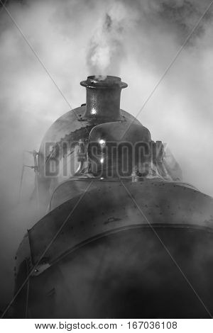 Restored Victorian Era Steam Train Engine With Full Steam In Black And White