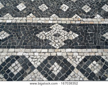 Typical Portuguese black and white stone mosaic 