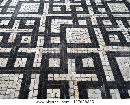Typical Portuguese black and white stone mosaic 