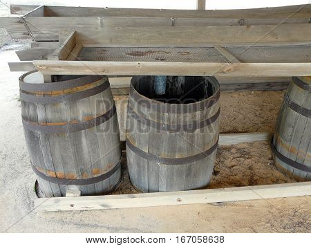 A still at St. Andrews State Park Panama City Florida displays the barrels used to separate turpentine from water when distilling resin from pines.