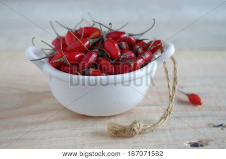 fresh heathy red goji berries of a wooden board