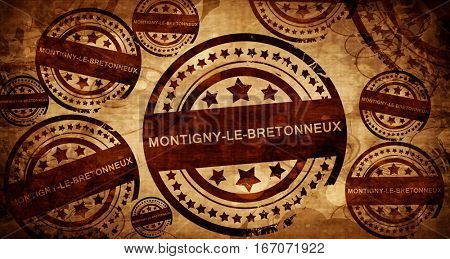 montigny-le-bretonneux, vintage stamp on paper background