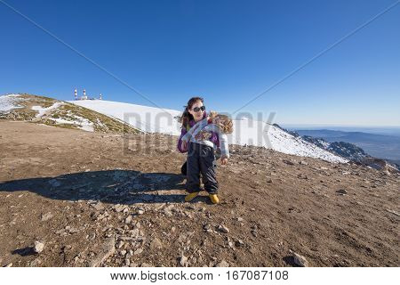 Portrait Of Child And Mother In Summit Of Mountain
