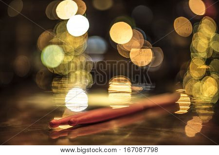 Drumsticks On A Gold Table