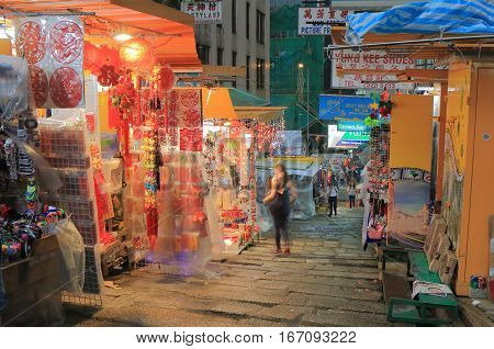 HONG KONG - NOVEMBER 8, 2016: Unidentified people visit Lan Kwai Fong night market. Lan Kwai Fong is a popular expatriate haunt in Hong Kong for drinking, clubbing and dining.
