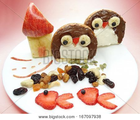 creative breakfast food with fruit and chocolate sweet cream on bread