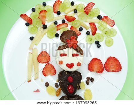 creative breakfast food with fruit and chocolate sweet cream on bread