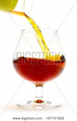 strong drink is poured and creates beautiful patterns in the glass for drinking