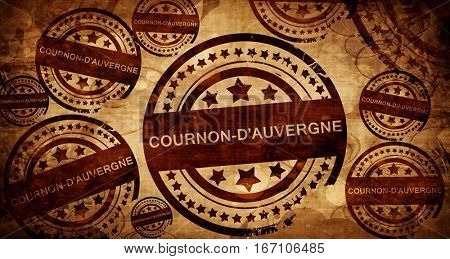 cournon d'auvergne, vintage stamp on paper background