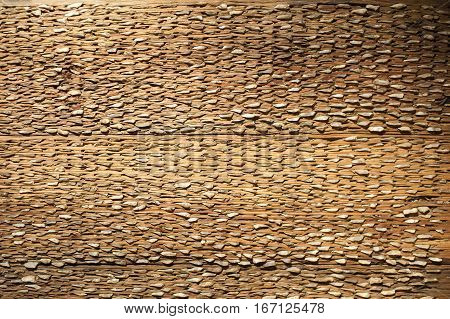 A threshing board (an obsolete farm implement used to separate cereals from their straw)