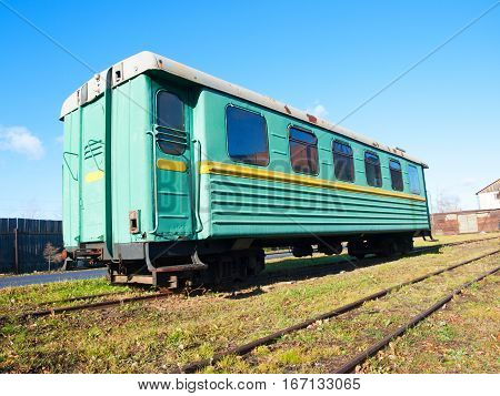 Green narrow-gauge railway wagon . . .