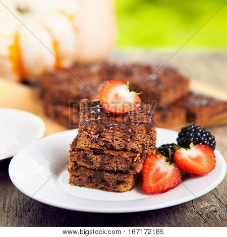 Flourless healthy pumpkin brownies with chocolate chips selective focus