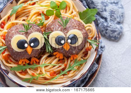 Pasta spaghetti with funny meatballs for kids. Birds in nests