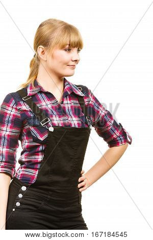 Gardening fahion concept. Smiling attractive woman in pink check shirt and dungarees. Isolated background