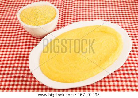 Corn porridge with the corn grits on a table