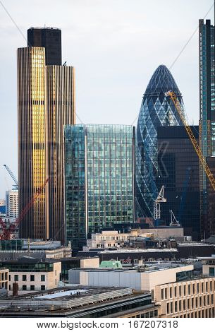 London, UK - December 19, 2016: City of London business aria view at sunset. View includes Gherkin building. City of London the leading financial centre in the Europe.