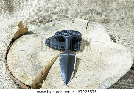 Tactical Knife On Stump With Case.