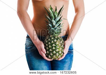 Female stomach and hands holding ananas. IVF, pregnancy concept.