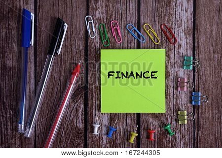 Tolls With Notes FINANCE Conceptual On Wooden Background