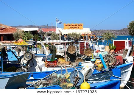 ELOUNDA, CRETE - SEPTEMBER 17, 2016 - Traditional fishing boats in the harbour Elounda Crete Greece Europe, September 17, 2016.