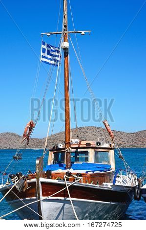 ELOUNDA, CRETE - SEPTEMBER 17, 2016 - Greek fishing boat moored in the harbour Elounda Crete Greece Europe, September 17, 2016.
