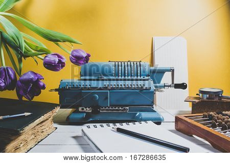 Old Calculating Machine On A Wooden Table