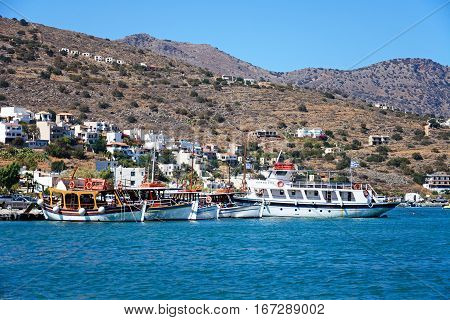 ELOUNDA, CRETE - SEPTEMBER 17, 2016 - Traditional Greek boats moored in the harbour Elounda Crete Greece Europe, September 17, 2016.