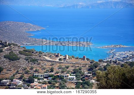 Elevated view of Elounda with views across the sea towards the island of Spinalonga Elounda Crete Greece Europe.