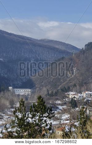 Residential district of bulgarian houses in winter village Pasarel with Hydro-Electric power station, Bulgaria