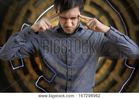 Young Man Is Concentrated And Looking For Solution For Difficult