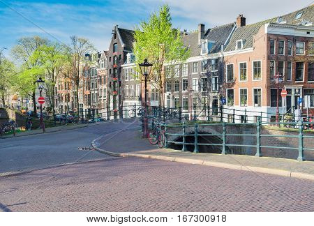 Street in old town with historical houses, Amstardam, Netherlands