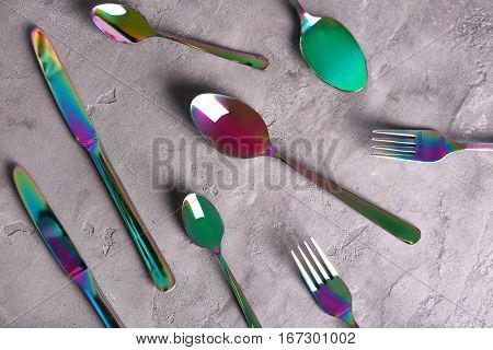 Set of cutlery on grey background