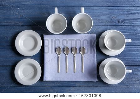 Tea set on blue wooden background
