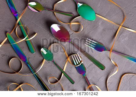 Set of cutlery on grey background
