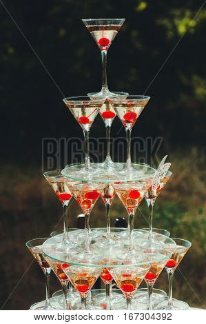 Pyramid glasses. Mount champagne on the table nature, wedding, catering