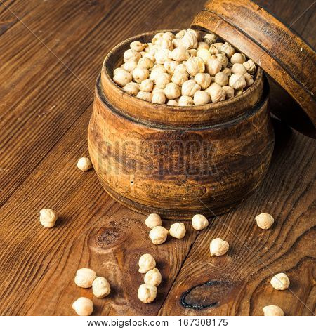 Portion of Chick Peas in wooden bowl.