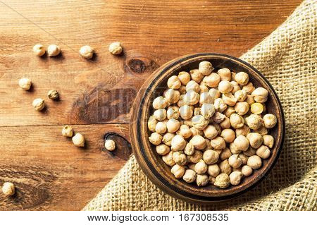 Portion of Chick Peas in wooden bowl.