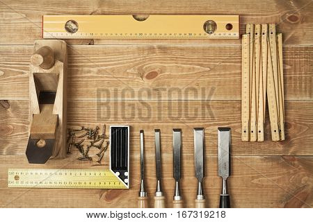 Set of different tools on a wooden planks