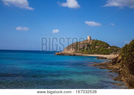 Italy Sardinia Torre di Chia bay with blue sky