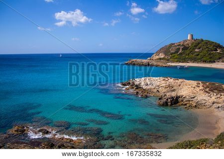 Torre di Chia bay Italy Sardinia with blue sky