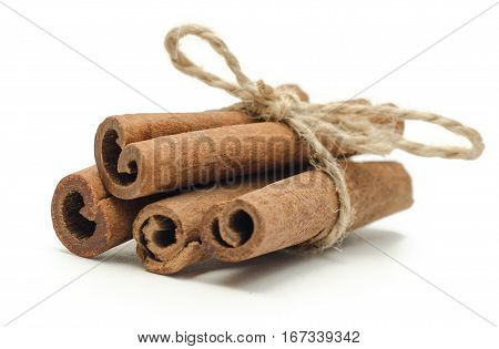 4 cinnamon close up isolated on white background When cinnamon is dried